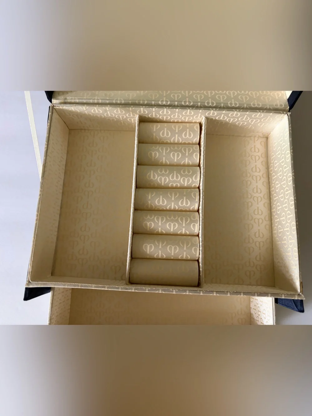 NWOT Cle’ de Peau elegant blue satin small/travel jewelry box. Mirror. Drawer